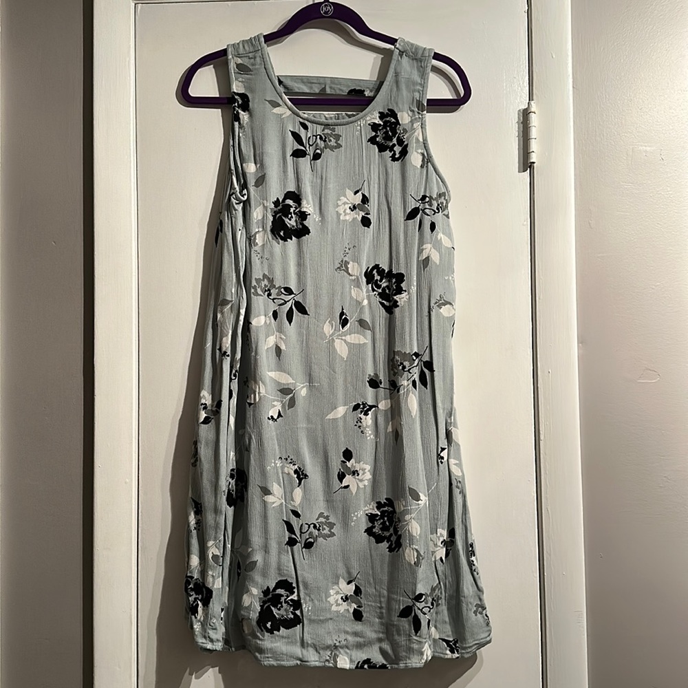 Green dress with white and black flowers.